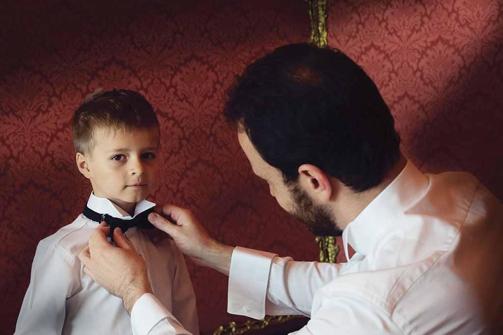 Wedding Photograph of groom and future son